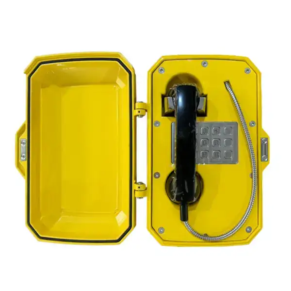 Yellow emergency phone booth with keypad and handset, weather-resistant for outdoor safety, ideal for public spaces, designed for quick emergency communication and security.