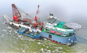 A large port vessel equipped with cranes and safety features at Ningbo Qijiashan Chemical Port.