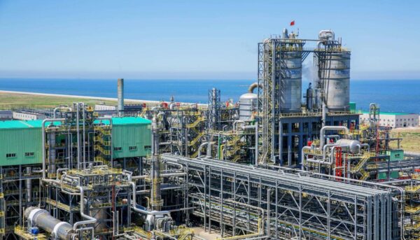 Industrial refinery and ethylene production facility at Sinochem Quanzhou, showcasing complex piping, distillation units, and processing towers for petrochemical manufacturing.