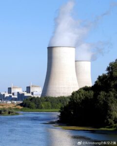 Cooling towers emitting steam at a nuclear power plant.