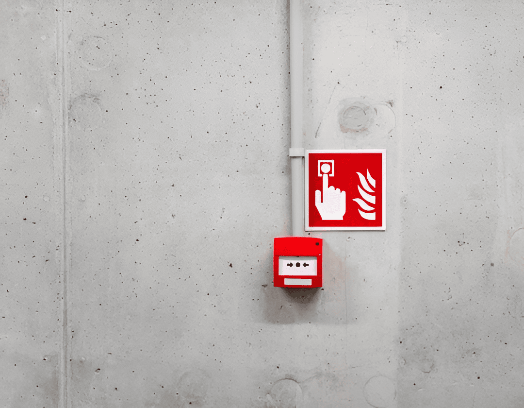 Fire alarm and emergency stop button for safety alert system.