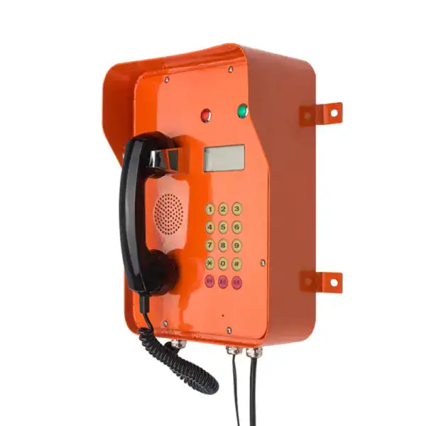 Emergency tunnel telephone with LCD display, orange housing, keypad, and handset for public safety communication.