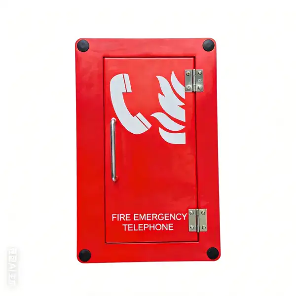 Emergency fire telephone enclosure for industrial safety and communication. Rugged red metal box with a phone icon and fire symbol, designed for quick access during emergencies.