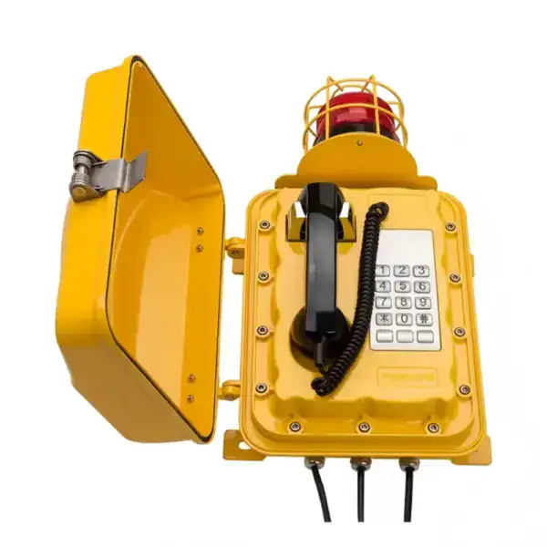 This image shows a yellow waterproof wall-mounted emergency telephone with a beacon light, designed for industrial and safety applications. The device features a sturdy protective cover, a rotary beacon light, and a keypad for emergency communication, ensuring reliable operation in harsh environments. Ideal for factories, warehouses, and public safety areas to provide quick access to emergency services.