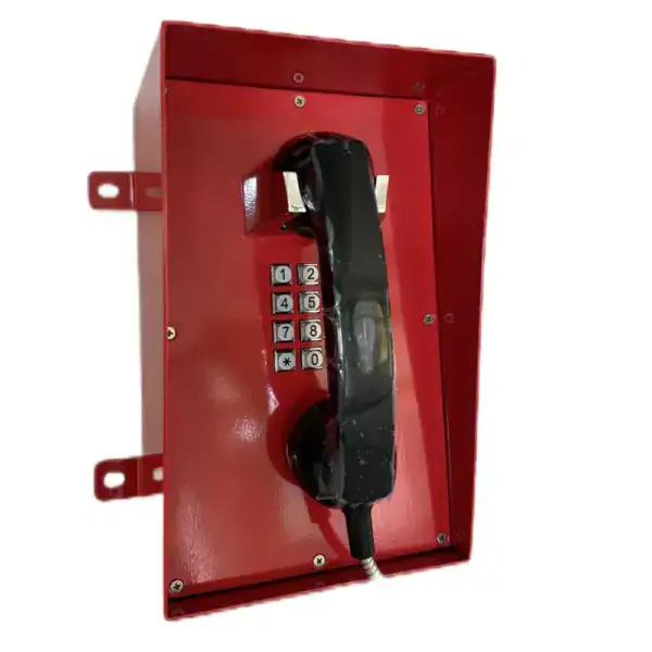 Weatherproof industrial telephone with keypad for outdoor communication.
