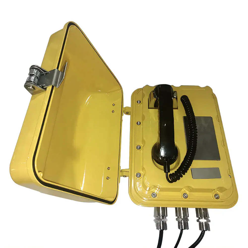 Wireless communication device with yellow protective casing and multiple connection ports. Ideal for industrial or remote applications, featuring a rugged design, antenna, and various input/output con.