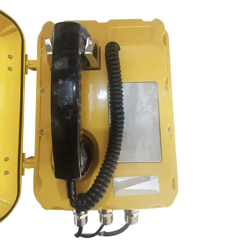 Wireless industrial emergency phone with rugged yellow casing and black handset, designed for harsh environments. Features durable construction, secure connections, and easy access for quick communica.
