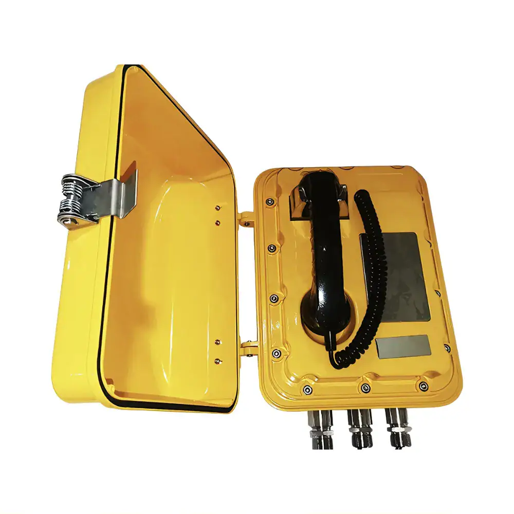 Bright yellow emergency telephone box with handset, digital display, and multiple connection ports, designed for safety and communication in critical situations.