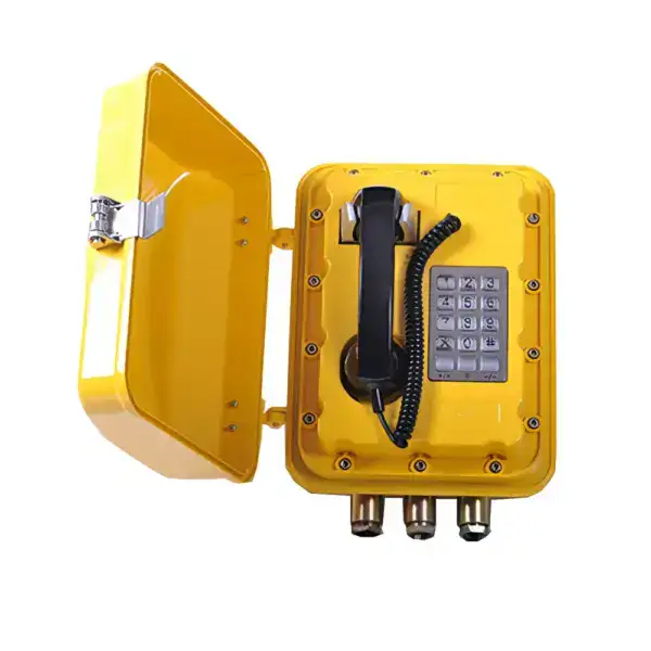 Proof heavy duty telephone in yellow with keypad and protective cover, designed for industrial environments requiring safety and durability.