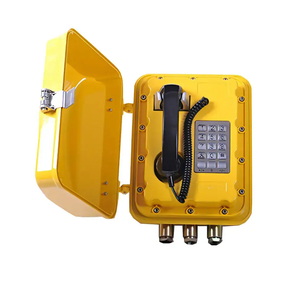 Proof heavy duty telephone in yellow with keypad and protective cover, designed for industrial environments requiring safety and durability.