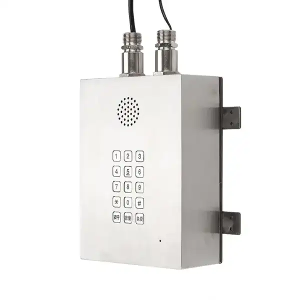 Explosion proof wall-mounted intercom with keypad and speaker for secure communication.