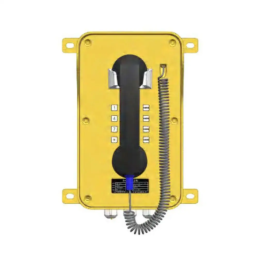 Outdoor waterproof industrial telephone with yellow housing, keypad, and coiled cord for rugged communication needs.